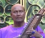 Maestro Sri Chinmoy performs on the Esraj